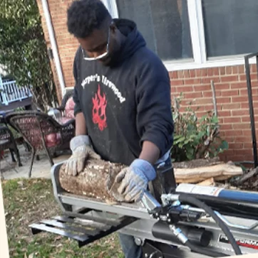 Austin Harper working on a firewood order for a client